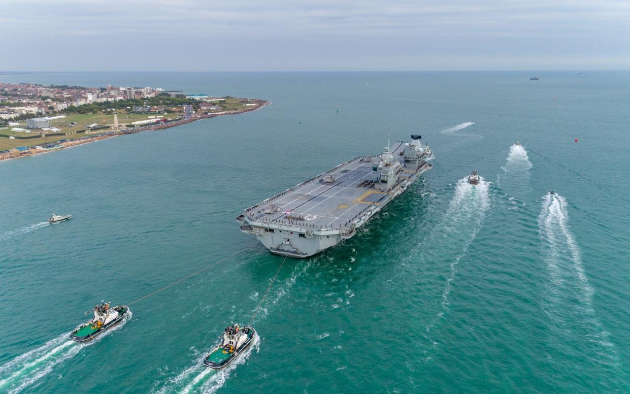 HMS Queen Elizabeth leaving Portsmouth's Naval Base in 2018