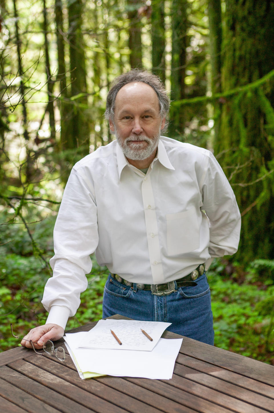 This March 24, 2003 courtesy photo released by Natural History photographer David Liittschwager, shows writer Barry Lopez near Blue River, Oregon. Barry Lopez, an award-winning writer who tried to tighten the bonds between people and place by describing the landscapes he saw in 50 years of travel, has died. He was 75. His family said Lopez died in Eugene, Oregon, on Friday, Dec. 25, 2020, after a years-long struggle with prostate cancer. An author of nearly 20 books on natural history studies, along with an essay and short story collections, Lopez was awarded the National Book Award in 1986 for "Arctic Dreams: Imagination and Desire in a Northern Landscape." It was the result of almost five years of traveling the Arctic. (David Liittschwager via AP)