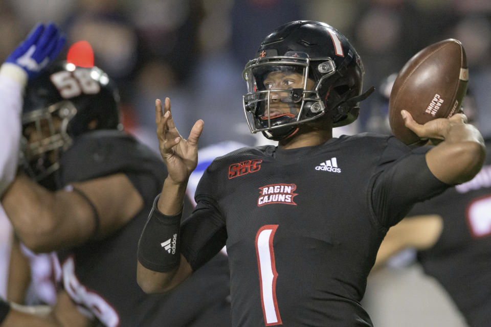 Louisiana-Lafayette quarterback Levi Lewis (1) throws a pass during the first half of the team's NCAA college football game against Georgia State in Lafayette, La., Thursday, Nov. 4, 2021. (AP Photo/Matthew Hinton)