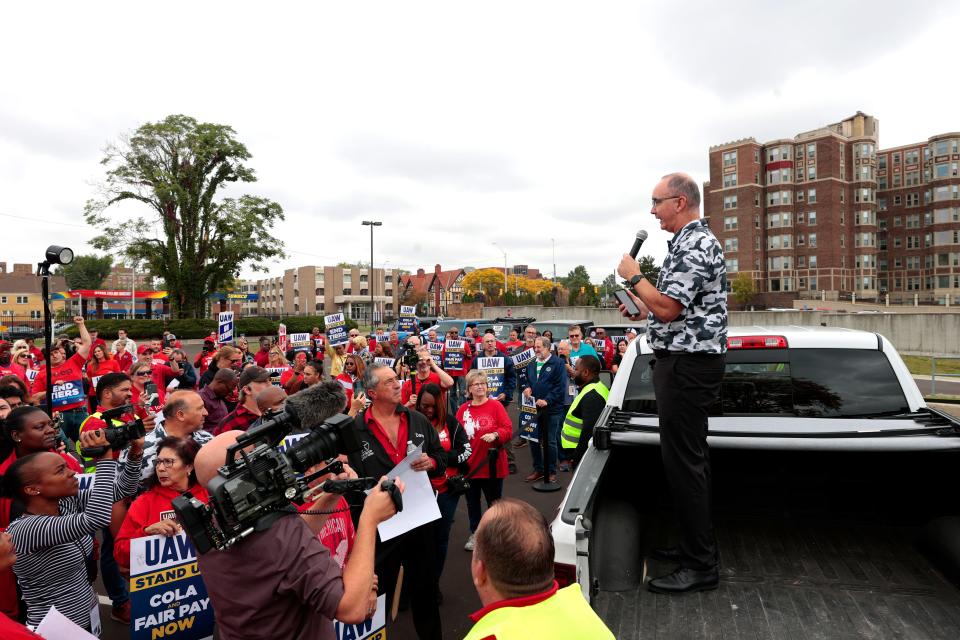 Standing in the bed of a Ford F-150, UAW President Shawn Fain speaks to the crowd of strikers at the parking lot of the UAW Solidarity House on Jefferson Avenue in Detroit on Friday, Sept. 29, 2023, during a rally.