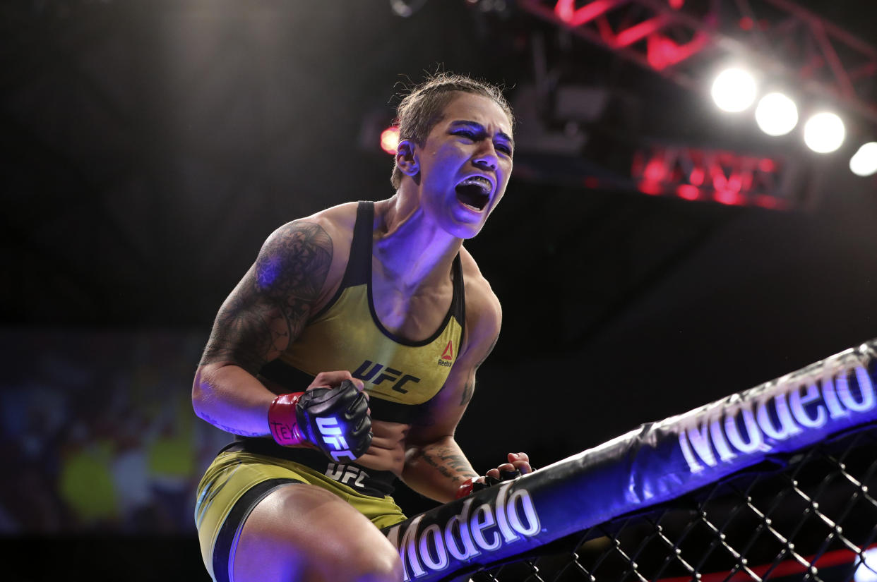 Sep 8, 2018; Dallas, TX, USA; Jessica Andrade (red gloves) reacts after defeating Karolina Kowalkiewicz  (not pictured) during UFC 228 at American Airlines Center. Mandatory Credit: Kevin Jairaj-USA TODAY Sports