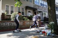 A makeshift memorial for recently passed Associate Justice of the Supreme Court of the United States Ruth Bader Ginsburg is seen outside her childhood home in Brooklyn, New York