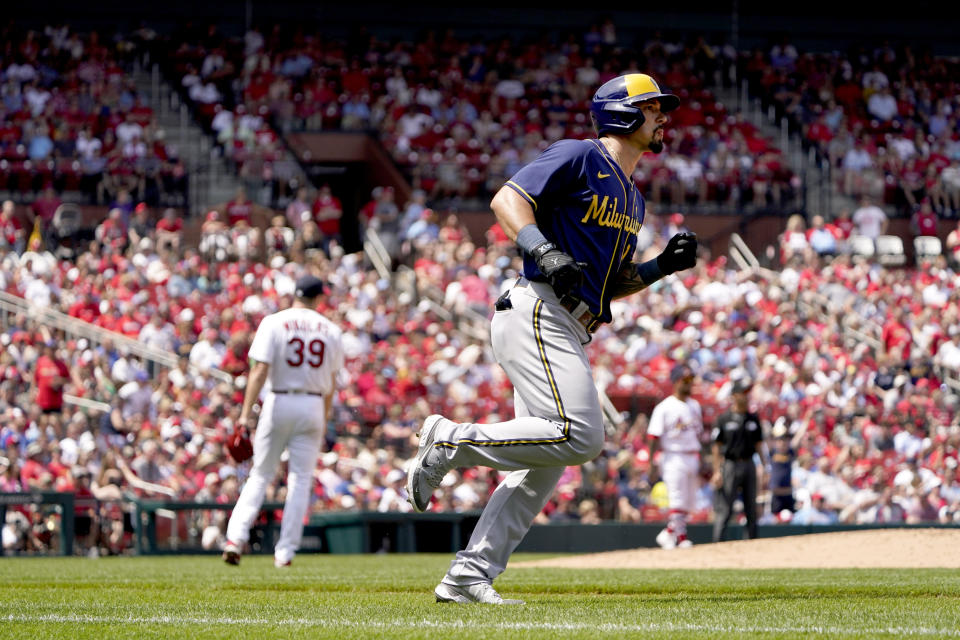Milwaukee Brewers' Jace Peterson, right, rounds the bases after hitting a three-run home run off St. Louis Cardinals starting pitcher Miles Mikolas (39) during the fifth inning of a baseball game Sunday, May 29, 2022, in St. Louis. (AP Photo/Jeff Roberson)