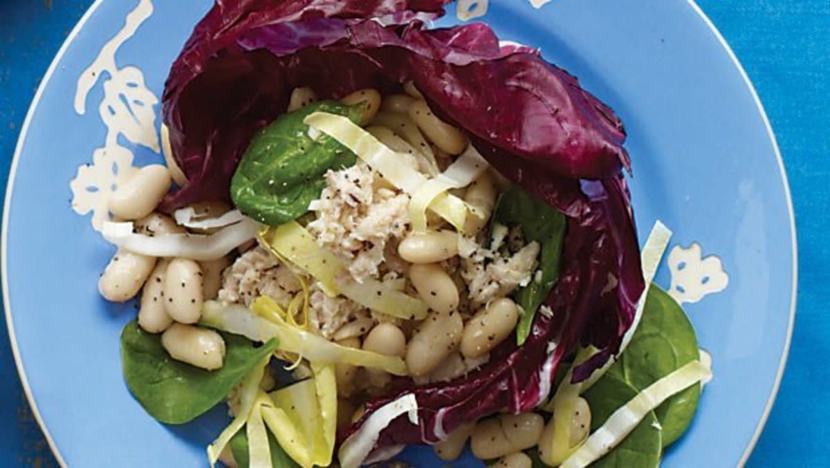 <p>Parade</p><p>Cannellini beans have a nutty flavor and creamy flesh. They go well in salads like this one, which combines three leafy veggies with protein-rich tuna.</p><p><strong>Get the recipe: <a href="https://parade.com/30766/dash/tuna-and-white-bean-salad/" rel="nofollow noopener" target="_blank" data-ylk="slk:Tuna and White Bean Salad;elm:context_link;itc:0;sec:content-canvas" class="link rapid-noclick-resp"><em>Tuna and White Bean Salad</em></a></strong></p>