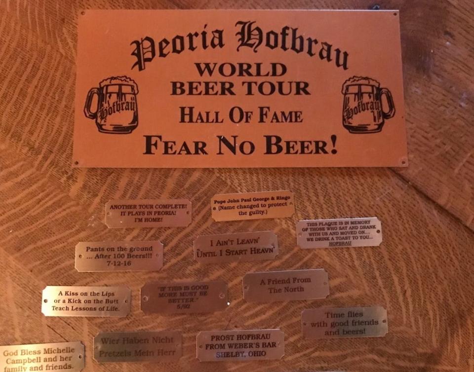 These plaques are among hundreds pulled from the walls of the shuttered Peoria Hofbrau, 2210 NE Jefferson St. The plaques were earned by customers who completed the World Beer Tour at the Hofbrau, which is now closed and for sale. Henrietta Patty, longtime manager of the pub, is offering to send the plaques to the customers who earned them.