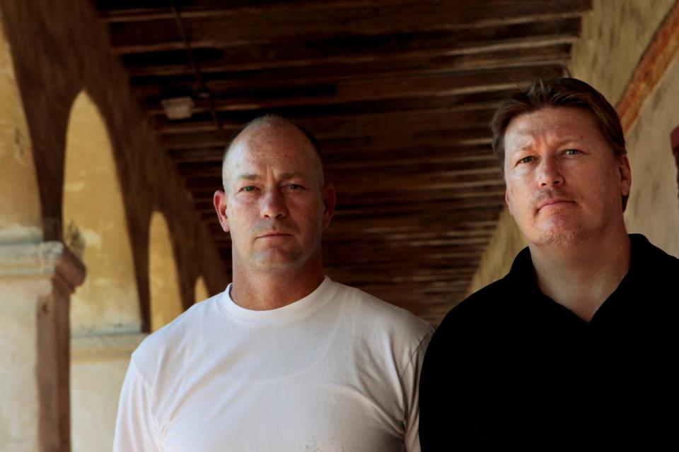 Damian Eckert, right, and his brother Bob Eckert, left, pose for a portrait outside the Santa Barbara Mission in Santa Barbara, California.