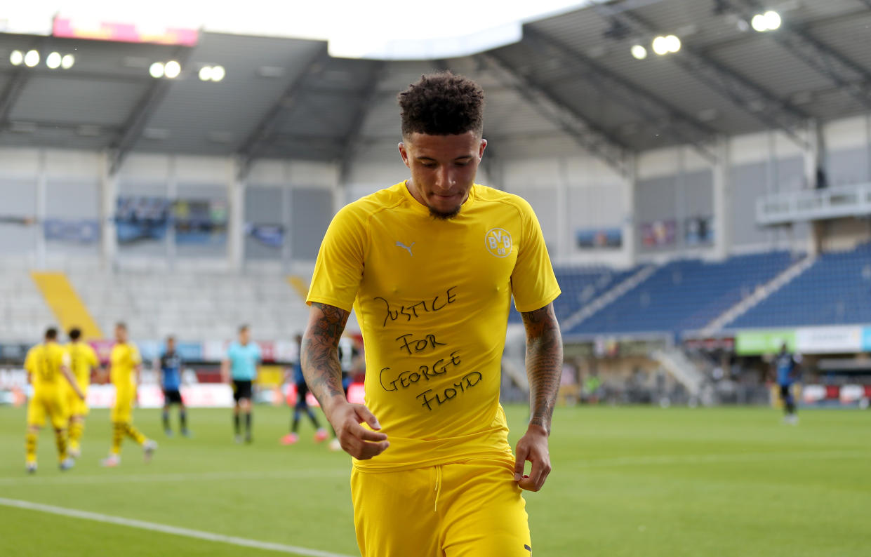 Jadon Sancho of Dortmund celebrates after scoring his teams second goal with a 'Justice for George Floyd' shirt during the Bundesliga match with SC Paderborn