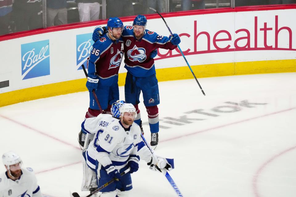 Colorado Avalanche right wing Valeri Nichushkin (13) celebrates his second-period goal against the Tampa Bay Lightning with right wing Mikko Rantanen (96).