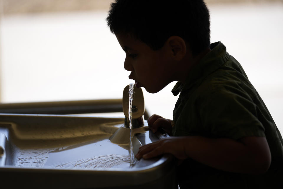 A student drinks from a water fountain inside Cuyama Elementary School, Wednesday, Sept. 20, 2023, in New Cuyama, Calif. (AP Photo/Marcio Jose Sanchez)