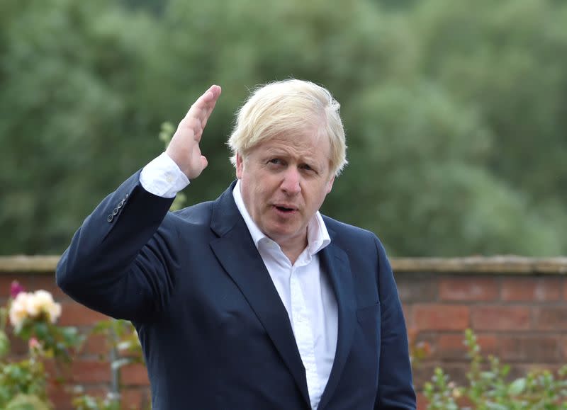 Britain's Prime Minister Boris Johnson speaks to local people at the Canal Side Heritage Centre in Beeston