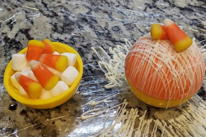 Halloween Hot Cocoa Bombs Inside showing marshmallows and candy corn