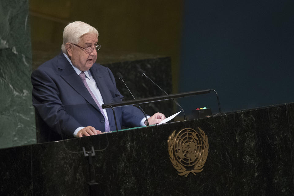 CORRECTS NAME OF SYRIAN DEPUTY PRIME MINISTER TO WALID AL-MOALLEM - Syrian Deputy Prime Minister Walid al-Moallem addresses the 73rd session of the United Nations General Assembly, Saturday, Sept. 29, 2018 at U.N. headquarters. (AP Photo/Mary Altaffer)