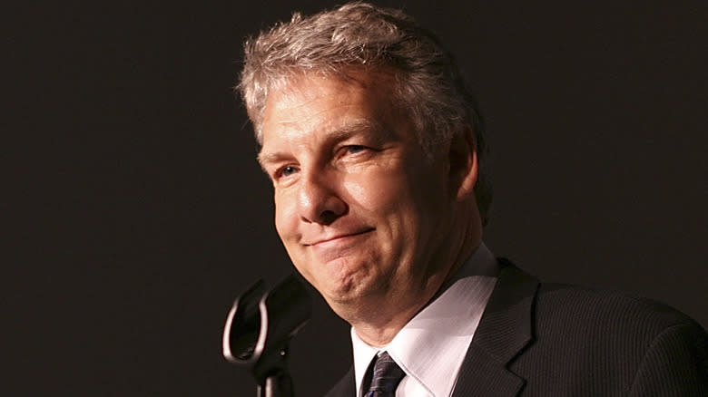 Marc Summers wincing at a microphone