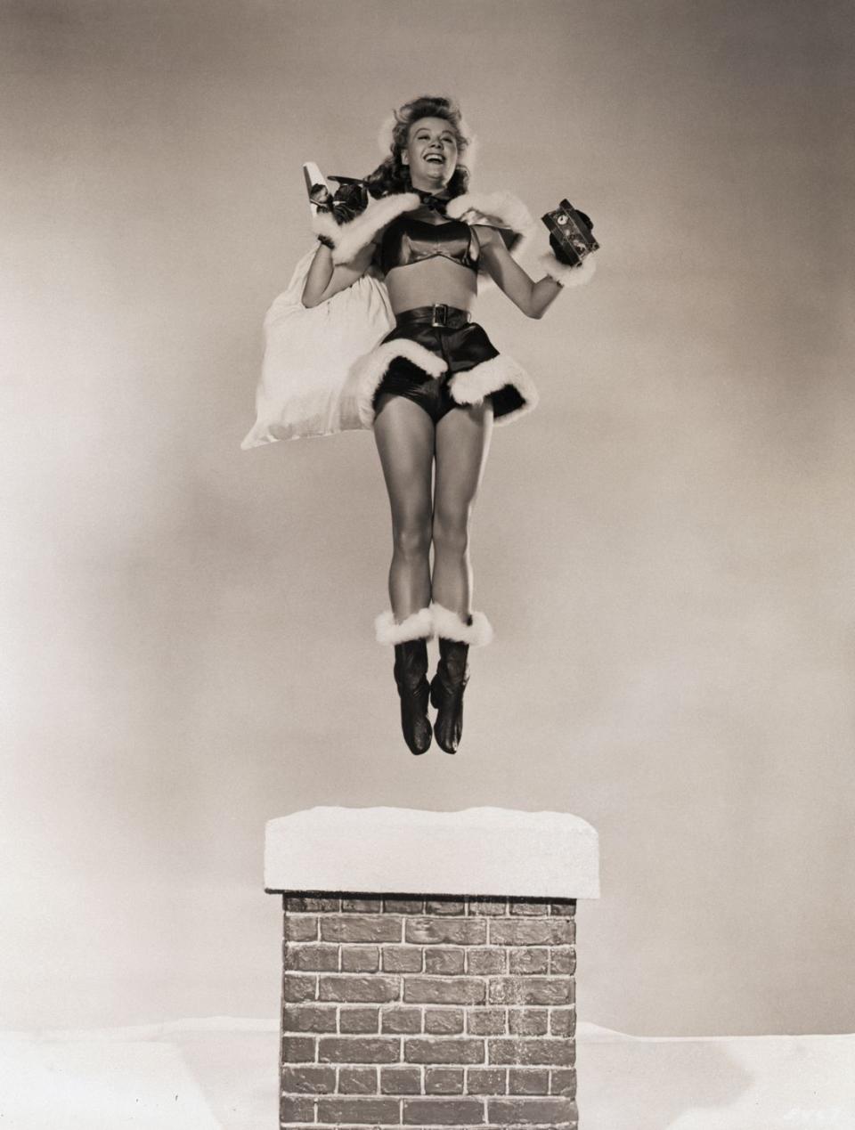 <p>The star of <em>White Christmas</em> seems to have no problem getting into the holiday spirit during a promotional shoot. Good thing!</p>