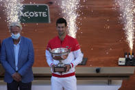 Former Swedish tennis ace Bjorn Borg, left, and Serbia's Novak Djokovic attend fireworks after Djokovic defeating Stefanos Tsitsipas of Greece in their final match of the French Open tennis tournament at the Roland Garros stadium Sunday, June 13, 2021 in Paris. Djokovic won 6-7 (6), 2-6, 6-3, 6-2, 6-4. (AP Photo/Christophe Ena)