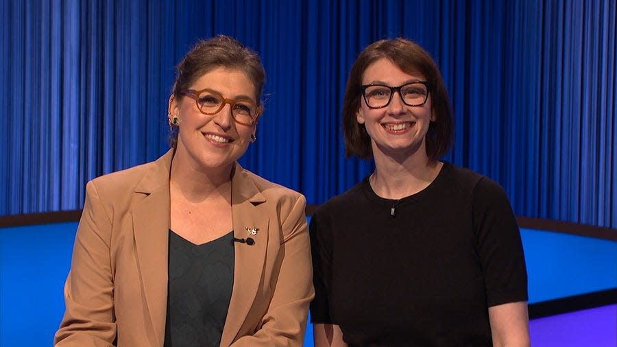 Mayim Bialik, host of Jeopardy!, left, with Donna Matturri, an Upper Arlington librarian. Matturri has won the trivia game show two consecutive days and is looking for a third win on Tuesday.