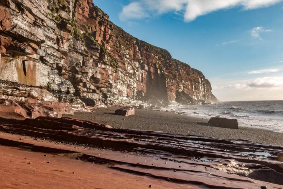 Fleswick Bay is one of several hidden gems on the Whitehaven Coastal Walk (Getty Images/iStockphoto)