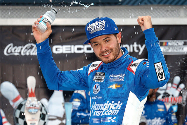 Kyle Larson celebrates after a race.