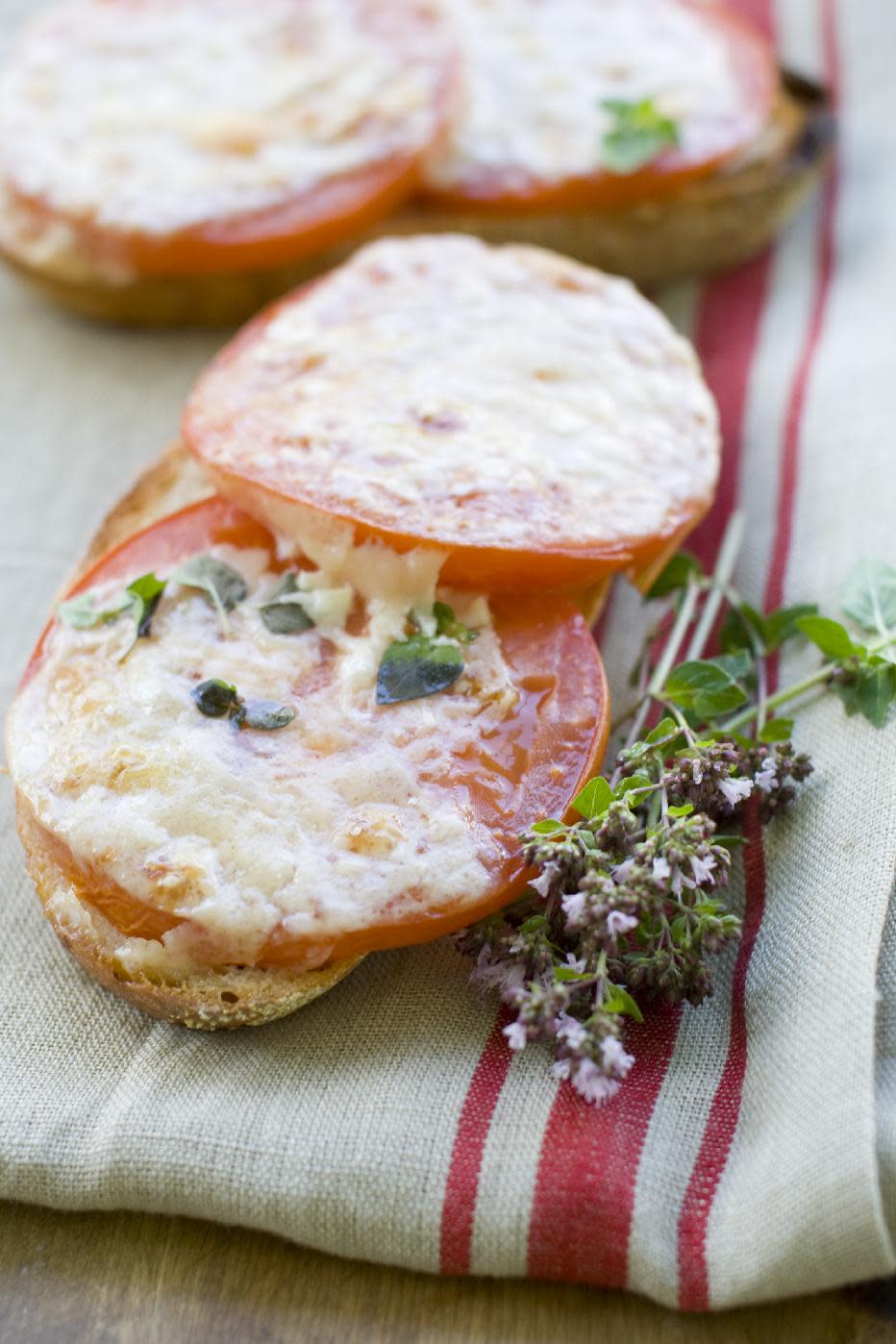 This July 15, 2013 photo shows toasted Parmesan tomato bread in Concord, N.H. (AP Photo/Matthew Mead)