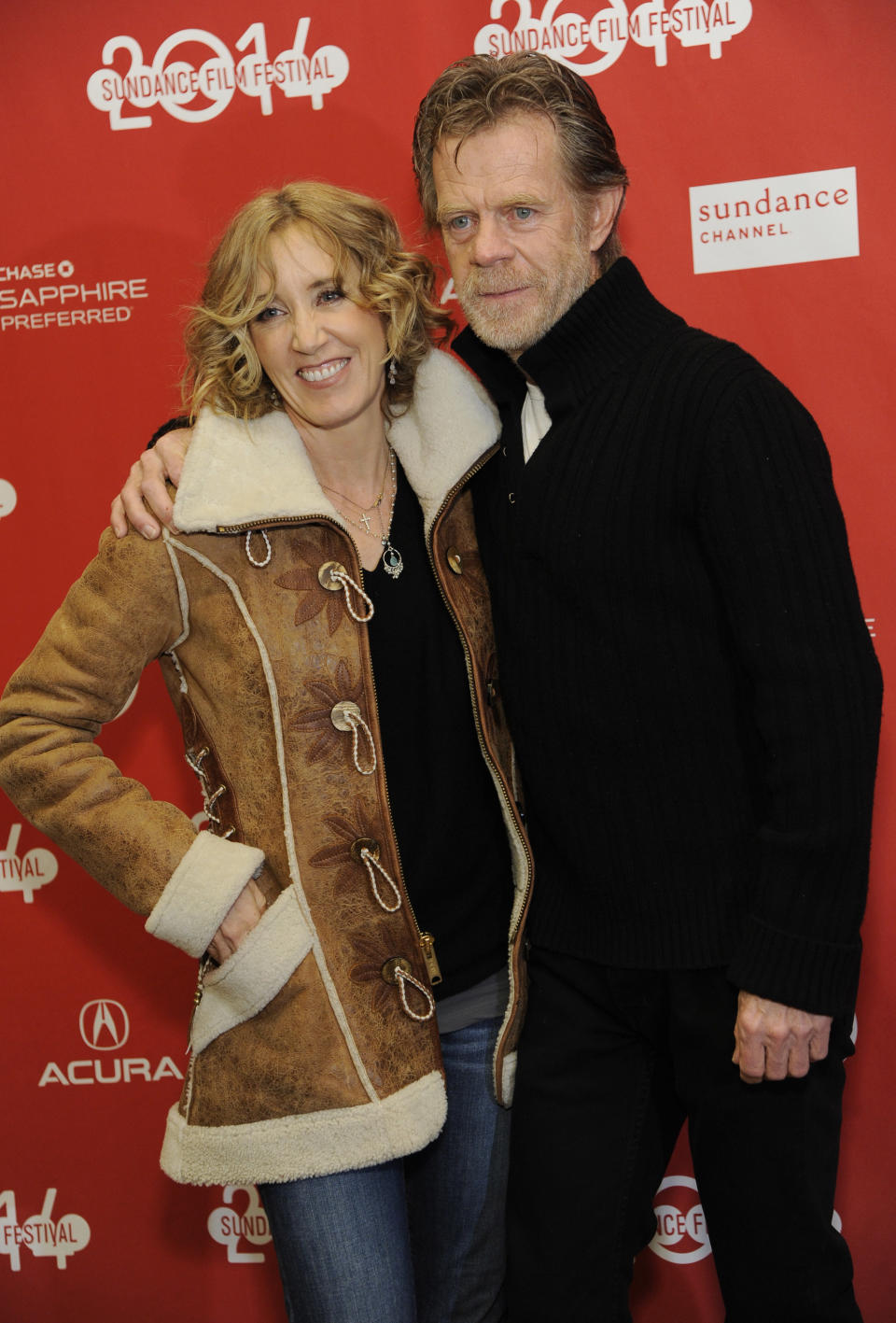 William H. Macy, right, writer/director/cast member of "Ruddlerless," poses with his wife, cast member Felicity Huffman, at the premiere of the film at the 2014 Sundance Film Festival, on Friday, Jan. 24, 2014, in Park City, Utah. (Photo by Chris Pizzello/Invision/AP)
