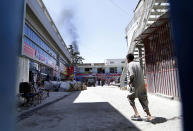 <p>Smoke rises from the scene of an ongoing attack on the Iraqi embassy in Kabul, Afghanistan, July 31, 2017. (Hedayatullah Amid/EPA/REX/Shutterstock) </p>