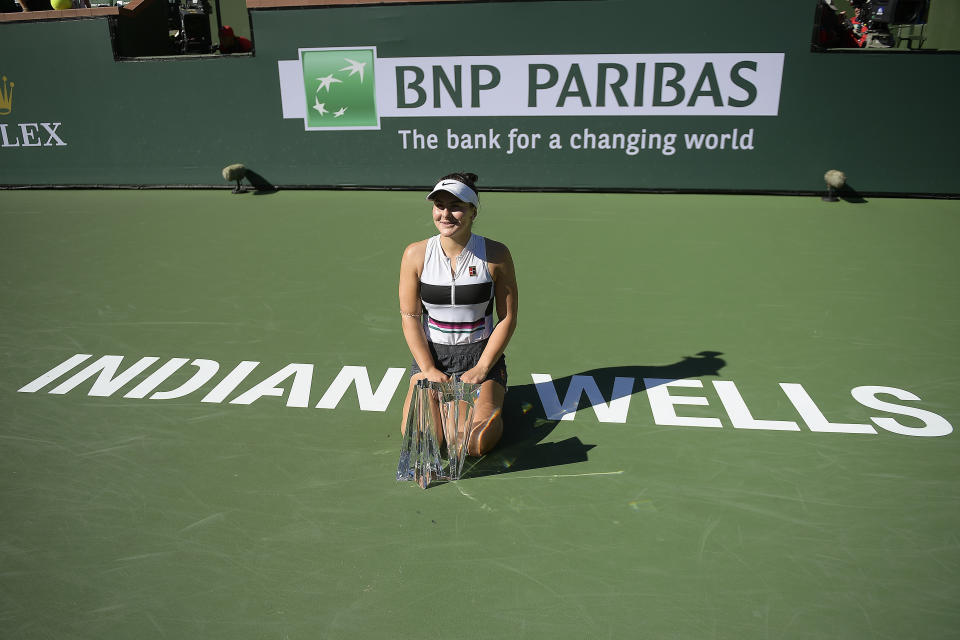 FILE - In this March 17, 2019, file photo, Bianca Andreescu, of Canada, poses with her trophy after defeating Angelique Kerber, of Germany, in the women's final at the BNP Paribas Open tennis tournament in Indian Wells, Calif. The BNP Paribas Open is returning to the Southern California desert this fall after being knocked out of its usual March dates this year and last because of the COVID-19 pandemic. (AP Photo/Mark J. Terrill, File)