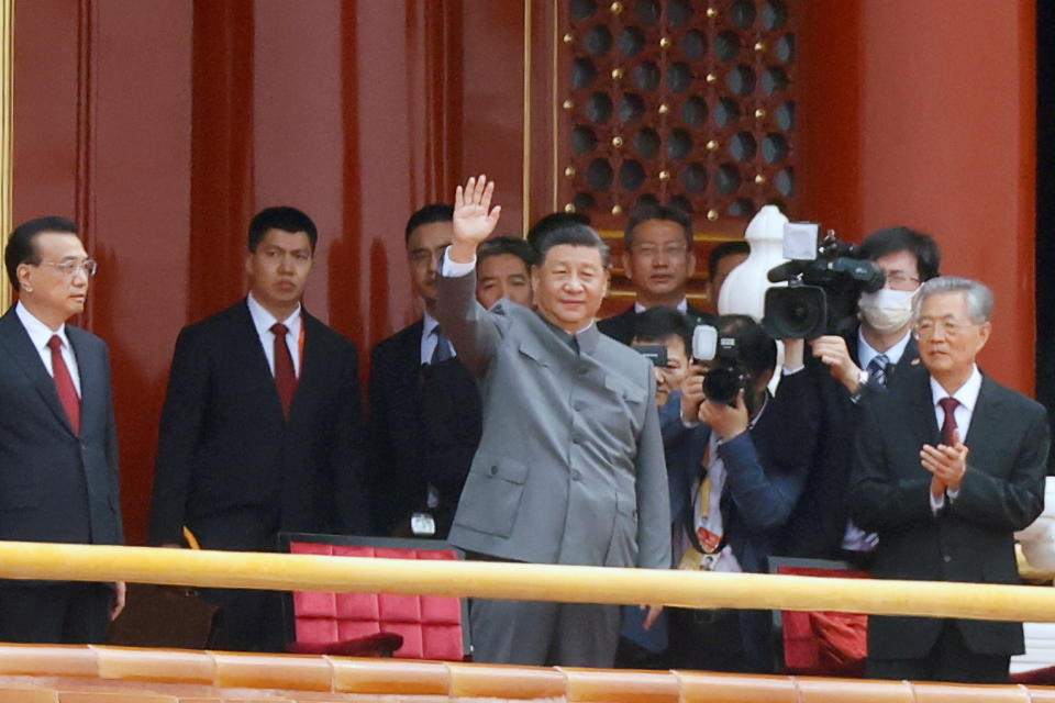 Chinese President Xi Jinping waves next to Premier Li Keqiang and former president Hu Jintao at the end of the event marking the 100th founding anniversary of the Communist Party of China, on Tiananmen Square in Beijing, China July 1, 2021. REUTERS/Carlos Garcia Rawlins     TPX IMAGES OF THE DAY