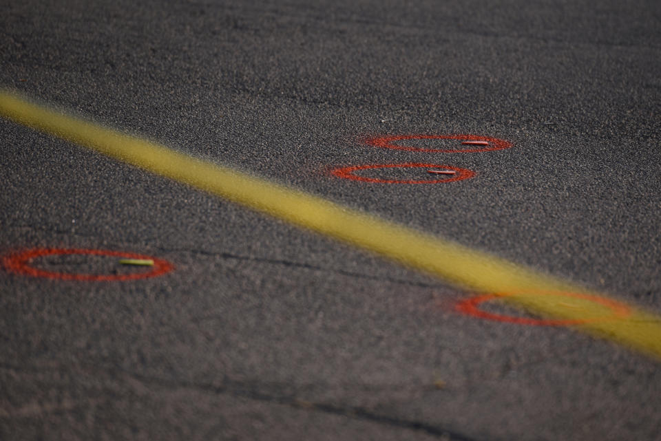 Police tape and evidences are seen as Texas state troopers and other emergency personnel monitor the scene at a local car dealership following a shooting in Odessa, Texas, U.S. September 1, 2019. REUTERS/Callaghan O'Hare