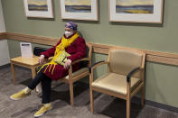 Lynda Shannon Bluestein sits in the waiting room prior to a cancer medicine infusion, Feb. 24, 2023, in Fairfield, Conn. (Paul Bluestein photo via AP)