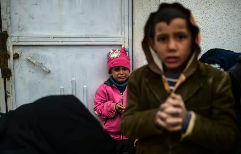 A refugee girl near the Turkish border, where thousands of Syrians fleeing the northern embattled city of Aleppo are stuck, on February 6, 2016