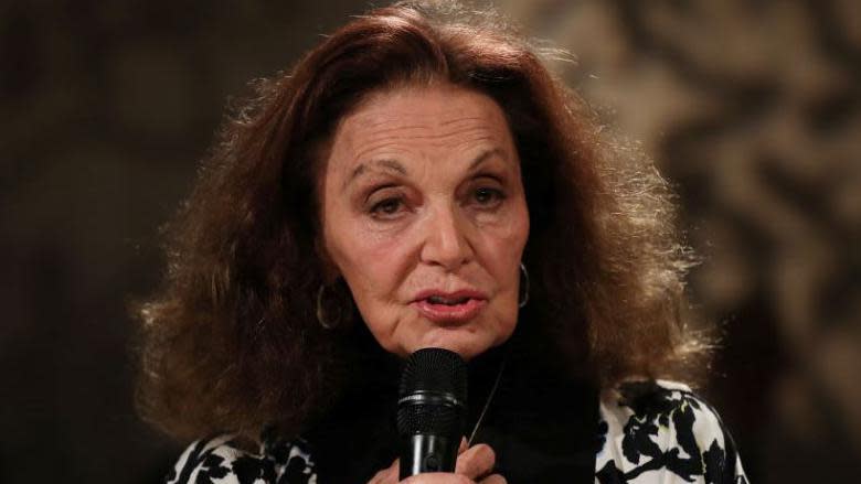 Diane von Furstenberg holding a microphone