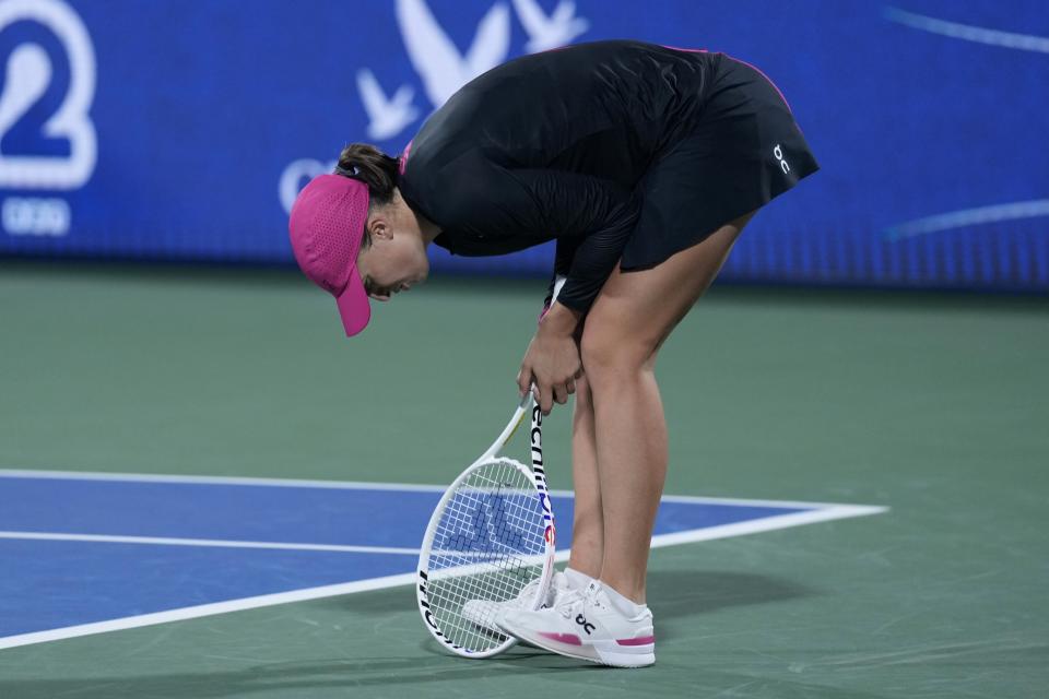 Iga Swiatek of Poland reacts after missing a ball against Anna Kalinskaya during a semi final match of the Dubai Duty Free Tennis Championships in Dubai, United Arab Emirates, Friday, Feb. 23, 2024. (AP Photo/Kamran Jebreili)