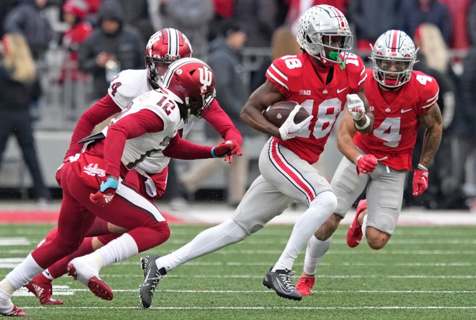 Nov 12, 2022; Columbus, Ohio, USA; Ohio State Buckeyes wide receiver Marvin Harrison Jr. (18) outruns the Indiana defense during their NCAA Division I football game between the Ohio State Buckeyes and the Indiana Hoosiers at Ohio Stadium. Mandatory Credit: Brooke LaValley-The Columbus Dispatch