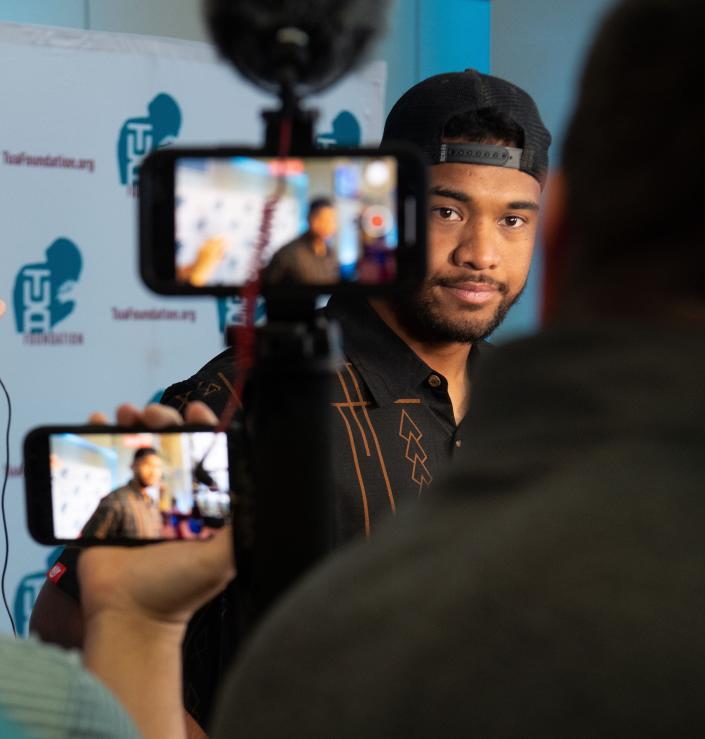 Tua Tagovailoa speaks to members of the news media during the Luau with Tua at The Zone inside Bryant-Denny Stadium in Tuscaloosa Wednesday, April 13, 2022. The event raises money for the Tua Foundation, the Boys &amp; Girls Clubs of West Alabama, and Nick&#39;s Kids. Gary Cosby Jr./Tuscaloosa News  