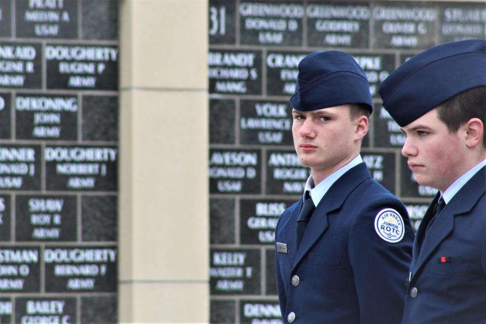 Air Force Junior Reserve Officer's Training Corps (JROTC) members stand at attention for Thursday's Veterans' Day memorial.