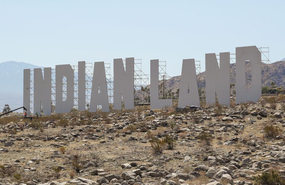 'Never Forget' by artist Nicholas Galanin sits several stories tall on an alluvial fan near Tramway Rd and Hwy 111 in Palm Springs, March 5, 2021.  The work is part of the Desert X exhibition.