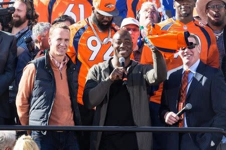 Feb 9, 2016; Denver, CO, USA; Denver Broncos quarter back Peyton Manning (left) and DeMarcus Ware (center) talk with radio host Dave Logan during the Super Bowl 50 championship parade celebration at Civic Center Park. Mandatory Credit: Isaiah J. Downing-USA TODAY Sports