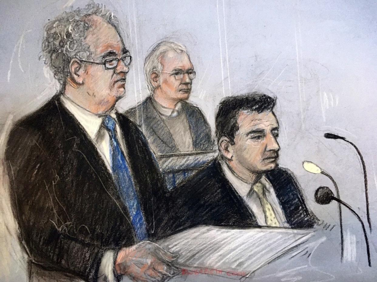 Julian Assange in the dock as his defence team, Edward Fitzgerald QC (left) and Mark Simmons QC, address Belmarsh Magistrates' Court in London for the Wikileaks founder's extradition hearing (Court artist sketch by Elizabeth Cook): PA