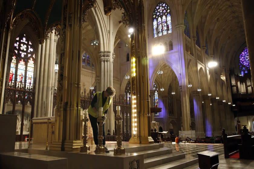 Lucia Popian prepares St. Patrick's Cathedral in preparation for Pope Francis' visit.