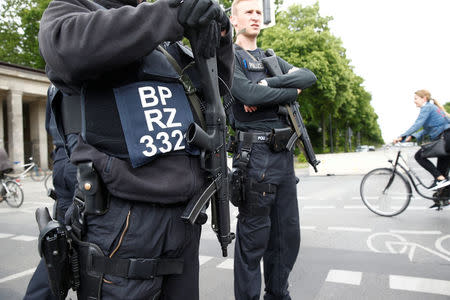 German Federal Police patrol next to a concrete barrier before the opening service of the German protestant church congress Kirchentag in front of the Brandenburg Gate in Berlin, Germany, May 24, 2017. REUTERS/Fabrizio Bensch