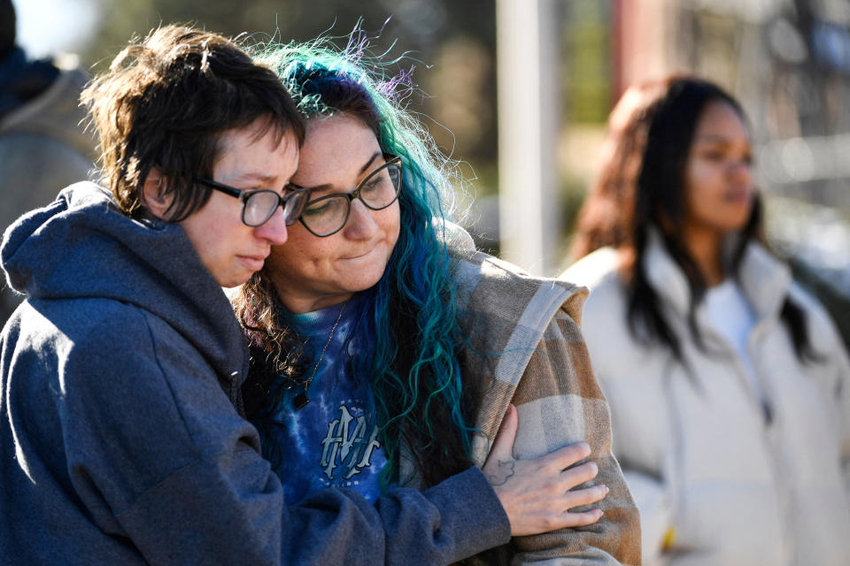 Jessy Smith Cruz embraces Jadzia Dax McClendon the morning after a mass shooting at Club Q, an LGBTQ nightclub in Colorado Springs, Colo.,, on Nov. 20, 2022. (Jason Connolly / AFP - Getty Images)