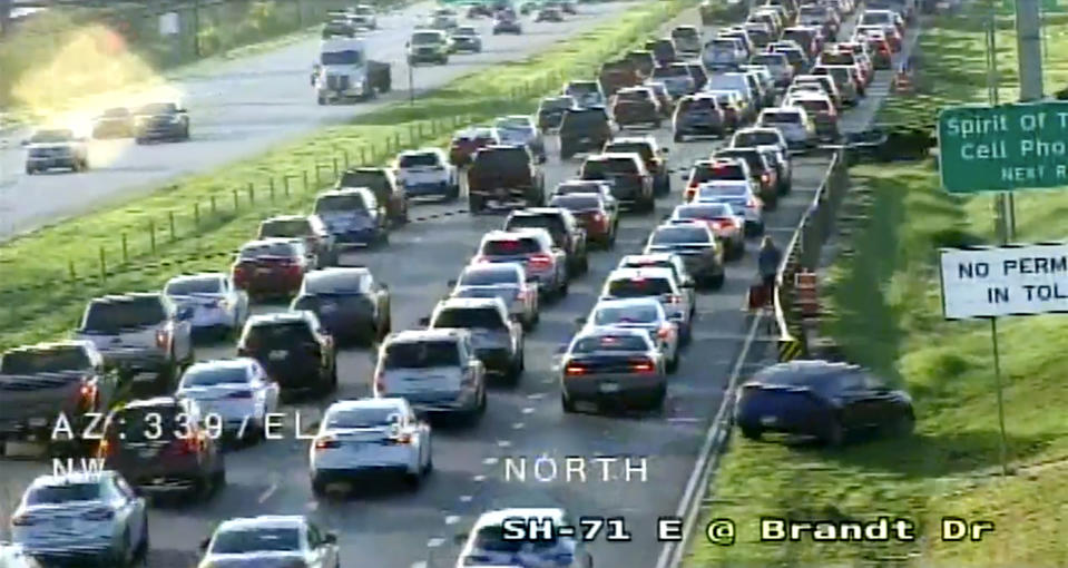 In this still image taken from video provided by Texas DOT, Traffic is backed up heading to Austin-Bergstrom International Airport on Wednesday, Sept. 7, 2022 in Austin, Texas. An early morning power outage at the airport caused flight delays that continued even after electricity was restored. The airport reported it lost power shortly before 5 a.m., and soon after said flights had been stopped. The lights were back on by 8 a.m., but airport officials told passengers that flights would be delayed.(Texas DOT via AP)