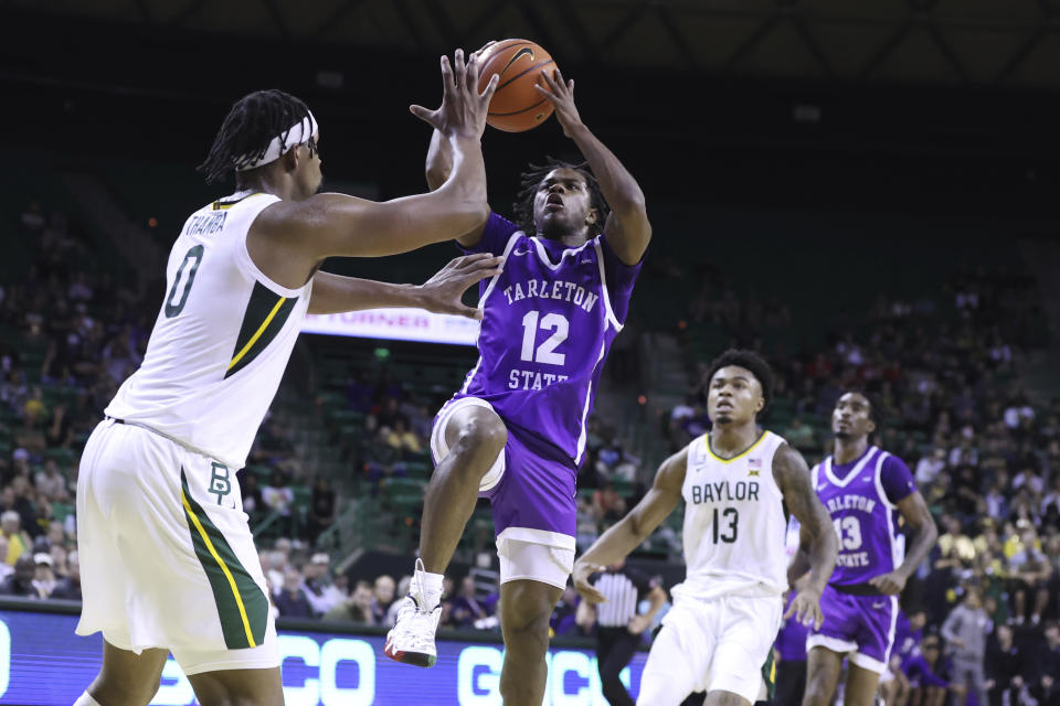 Tarleton State guard Tiger Booker shoots over Baylor forward Flo Thamba (0) in the first half of an NCAA college basketball game, Tuesday, Dec. 6, 2022, in Waco, Texas. (AP Photo/Rod Aydelotte)
