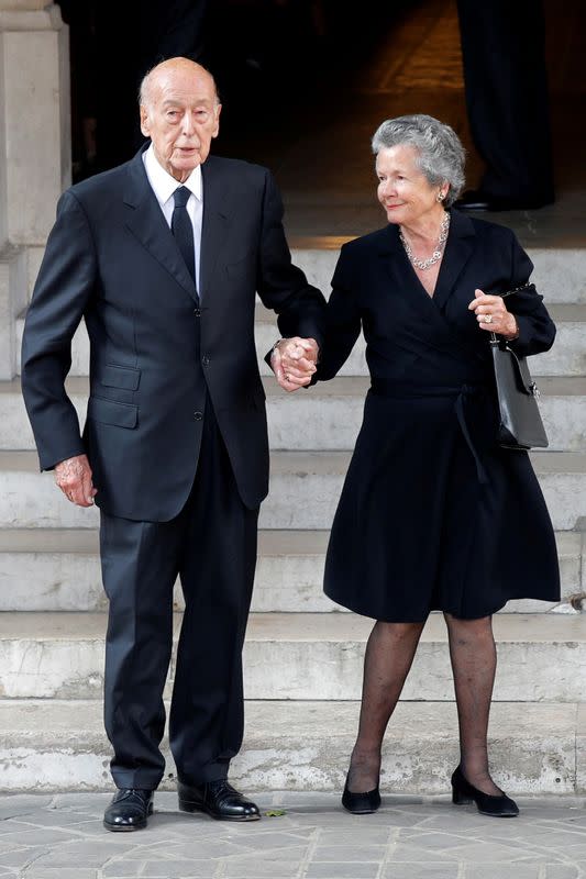 FILE PHOTO: Former French President Valery Giscard d'Estaing and his wife Anemone leave after the funeral ceremony for French businesswoman and billionaire Liliane Bettencourt in Neuilly-sur-Seine near Paris