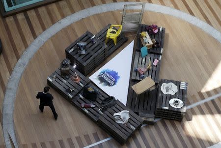 A man visits the exhibition Achados da Guanabara, or Found in Guanabara, at the Leblon mall in Rio de Janeiro March 24, 2015. REUTERS/Sergio Moraes