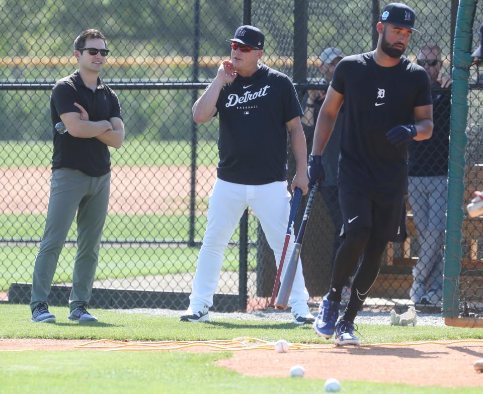 Tigers president of baseball operations Scott Harris and manager A.J. Hinch talk as outfielder Riley Greene waits his turn the batting cage  during spring training on Friday, Feb. 17, 2023, in Lakeland, Florida.