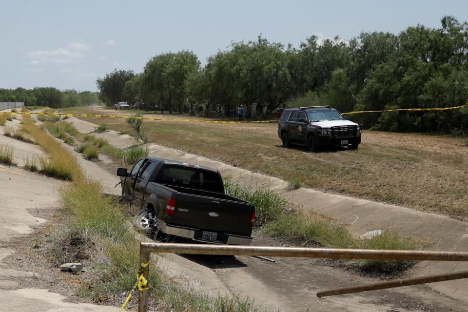 A police vehicle is seen parked near of a truck believed to belong to the suspect of a shooting at Robb Elementary School after a shooting, in Uvalde, Texas, U.S. May 24, 2022 (REUTERS)