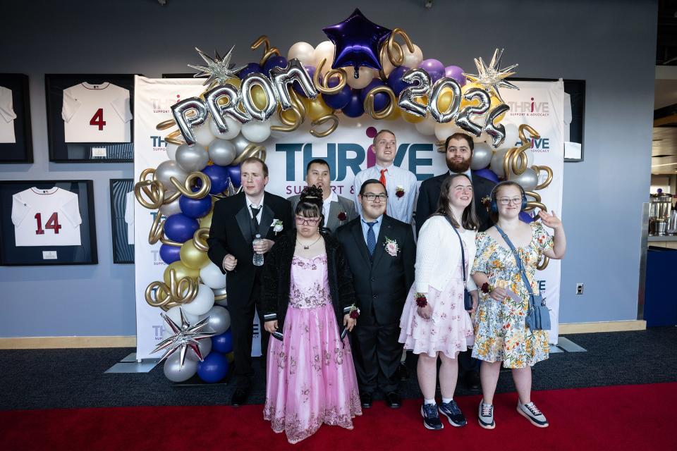 Guests takes photos at Thrive Support & Advocacy’s third annual Prom for All Ages at Polar Park.
