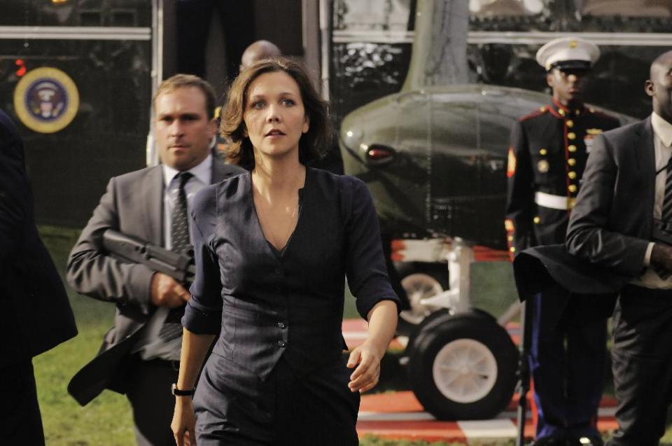 This film publicity image released by Columbia Pictures shows Maggie Gyllenhaal in a scene from "White House Down." (AP Photo/Sony Columbia Pictures, Reiner Bajo)