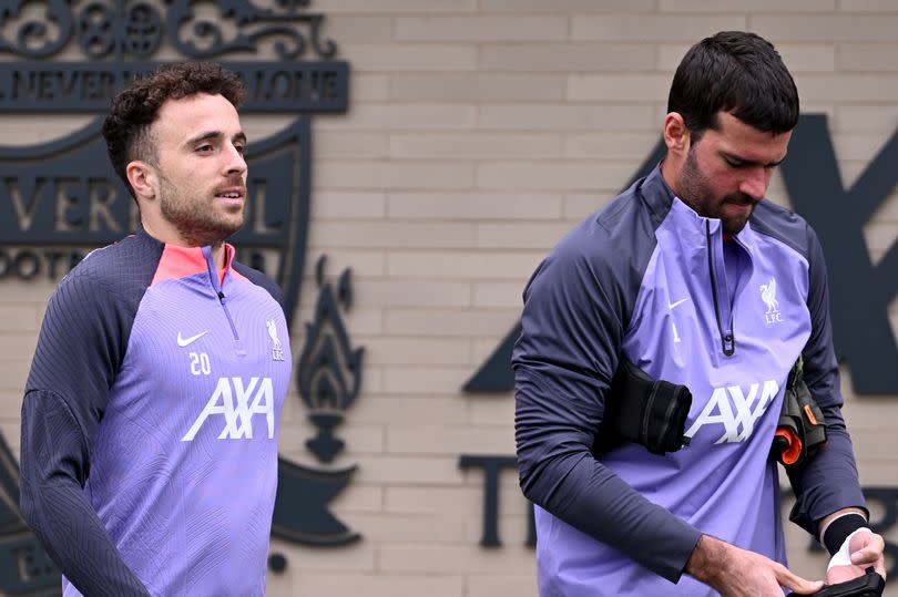 Diogo Jota and Alisson Becker of Liverpool during a training session at AXA Training Centre in Kirkby